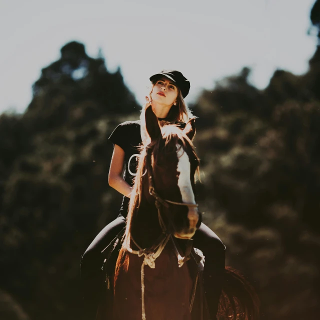 a woman is riding on the back of a horse