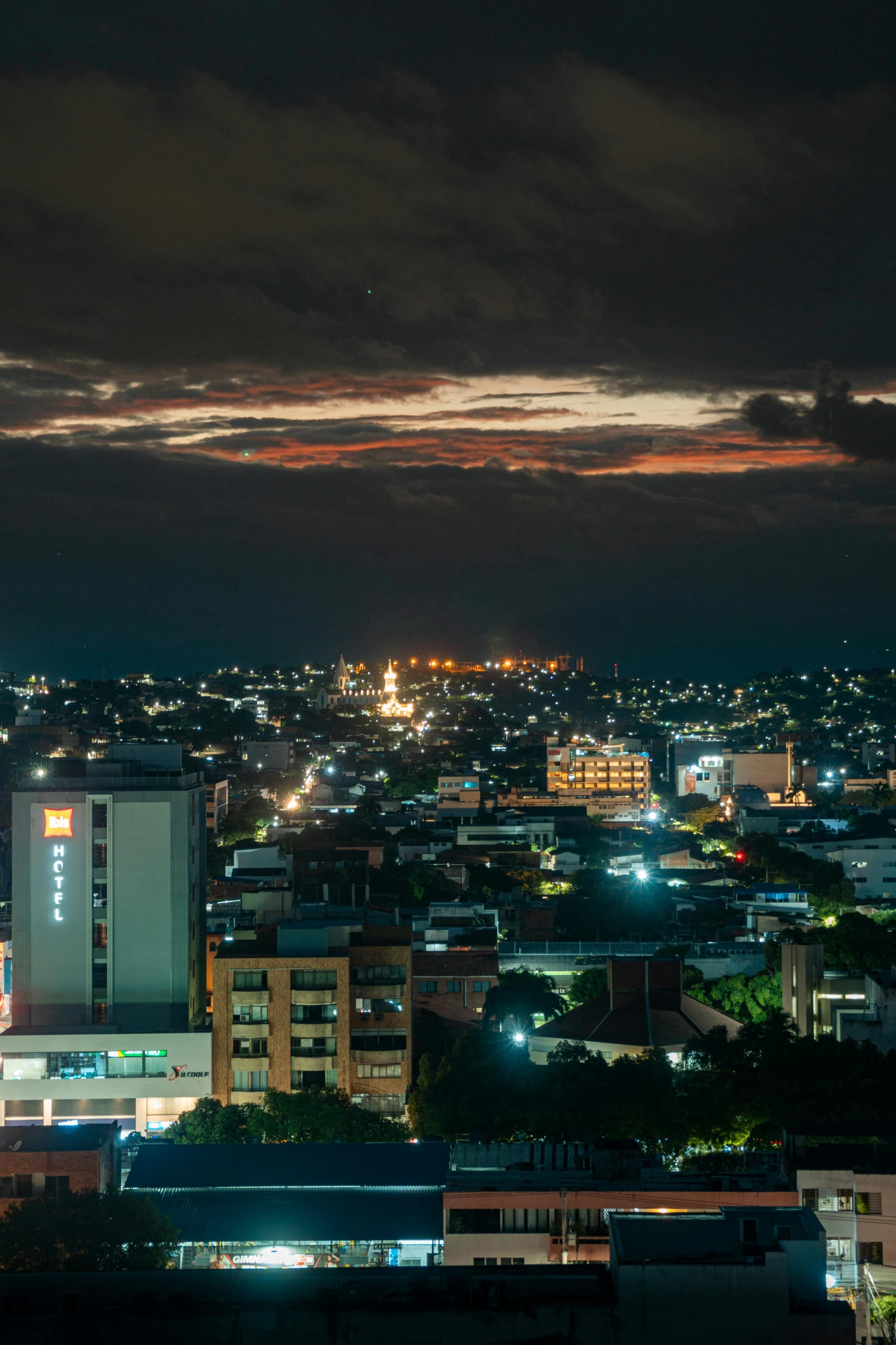 night view of urban buildings and skyline at dusk