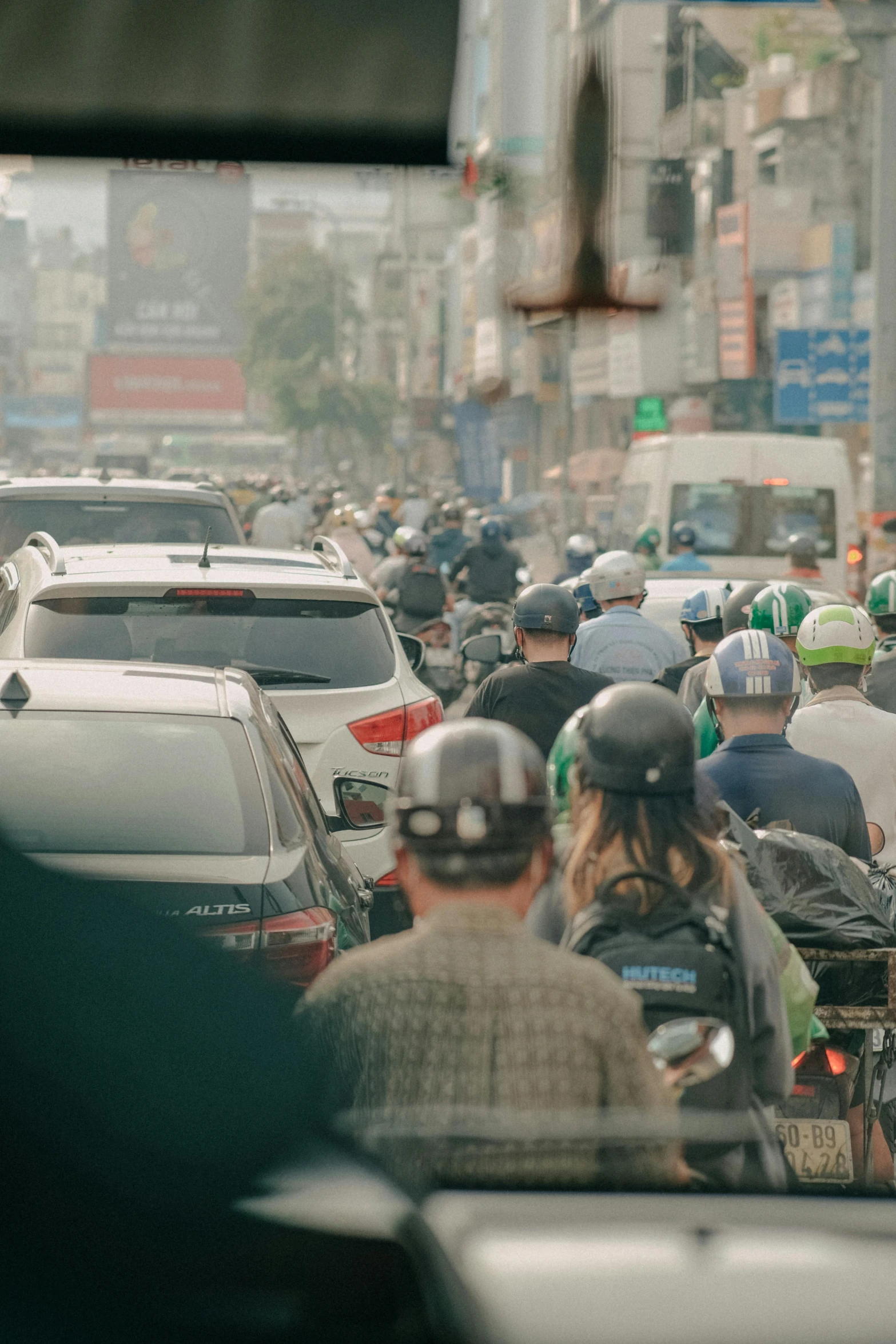 a busy city street full of pedestrians and traffic