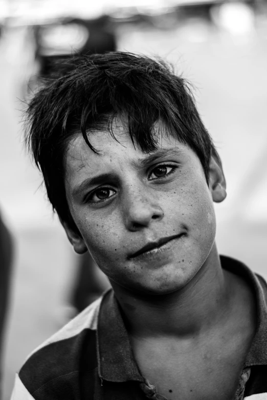 a boy with a collared shirt and a white shirt