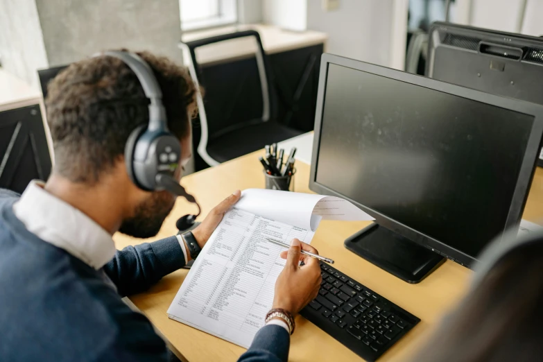 there is a man working on his computer