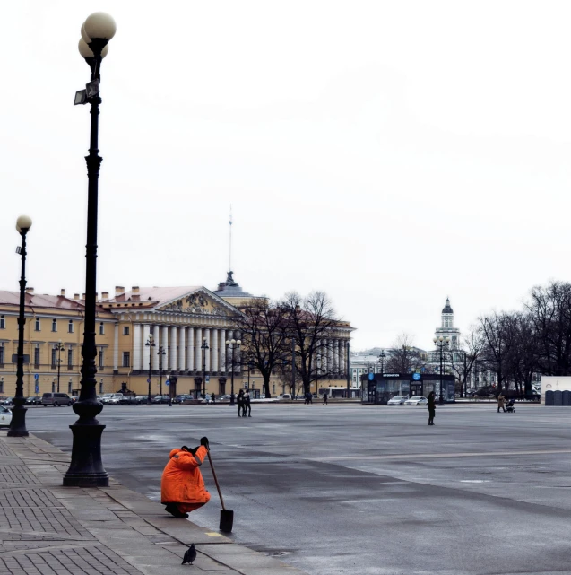 a person is sitting on the street outside