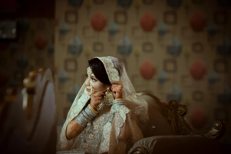 a woman in a wedding dress getting ready to put on makeup