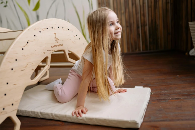 a  laying on top of a white mat