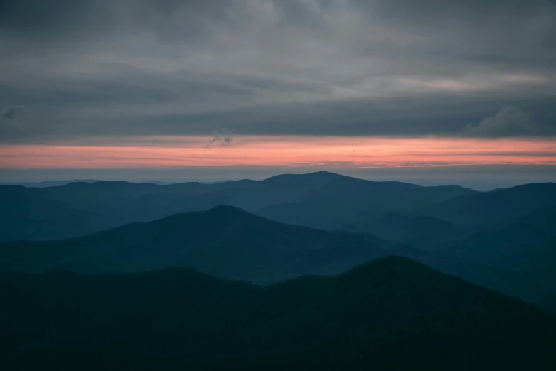 the view from a distant hilltop of hills