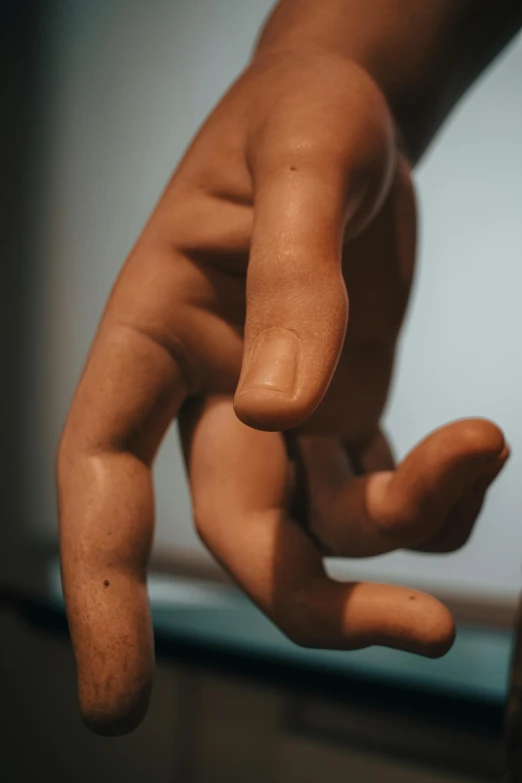 a hand that is made out of clay