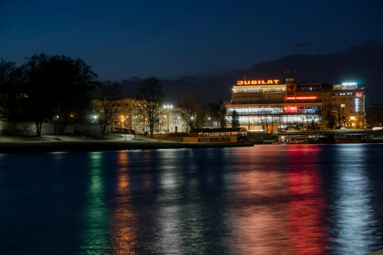 a view of a town at night with buildings lit up