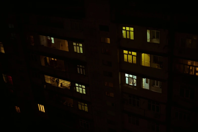 a building's windows lit up at night