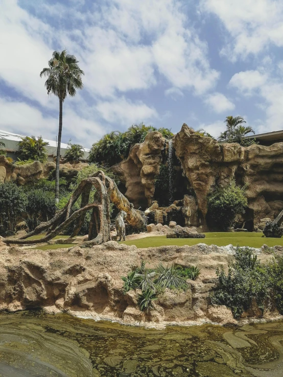 this is a scenic view of the waterfall and the pond