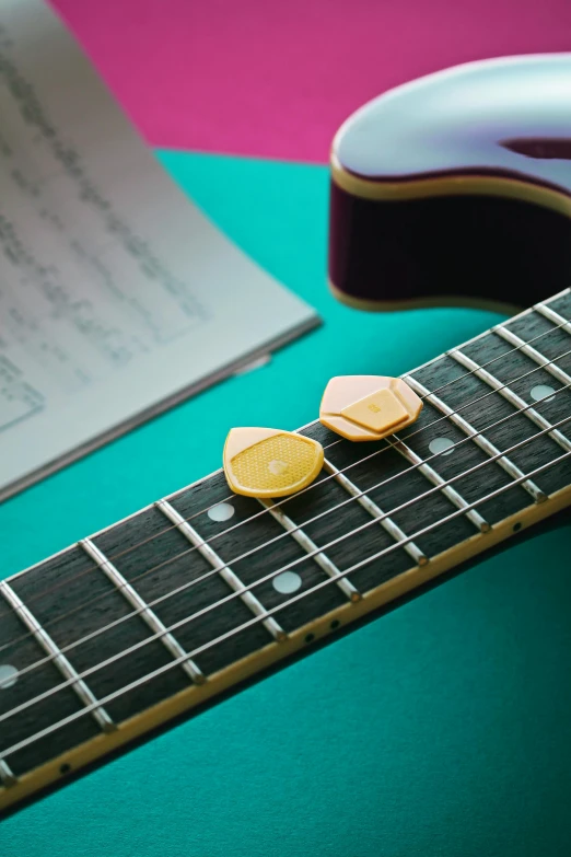 a guitar with some pickles stuck on it