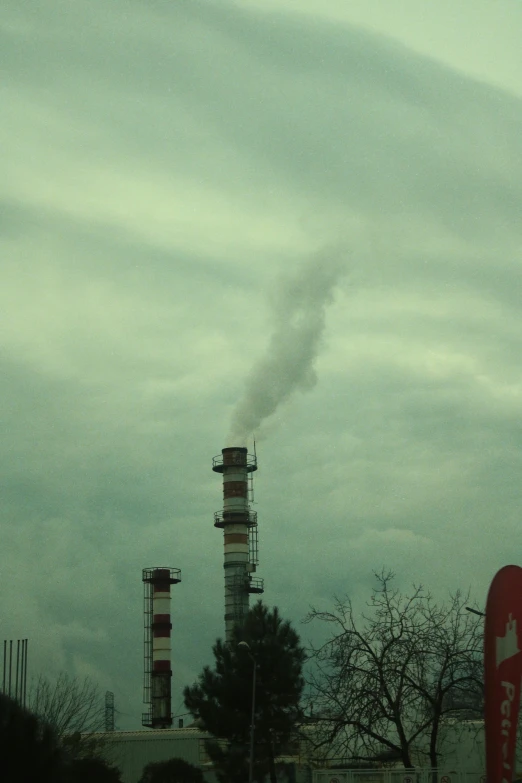 smoke billows from the stacks of stacks of smoke