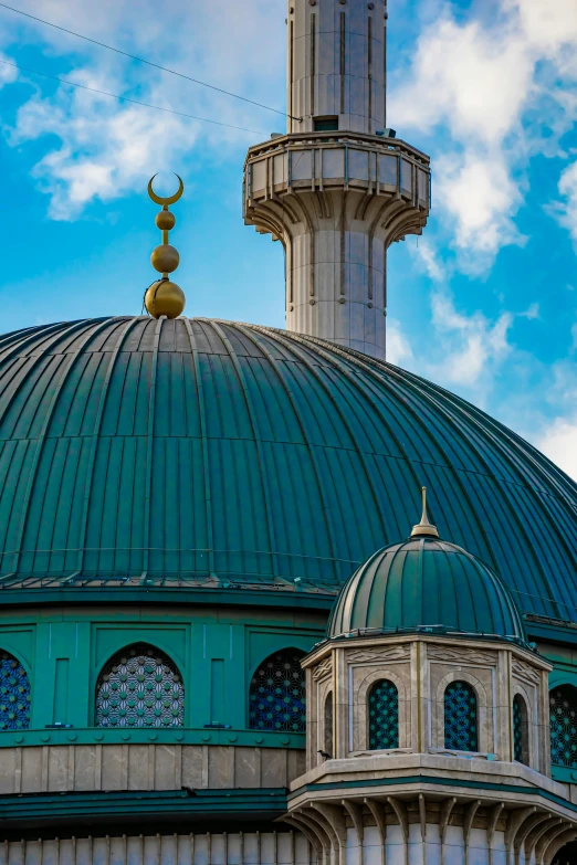 the dome and walls of an old blue and white building