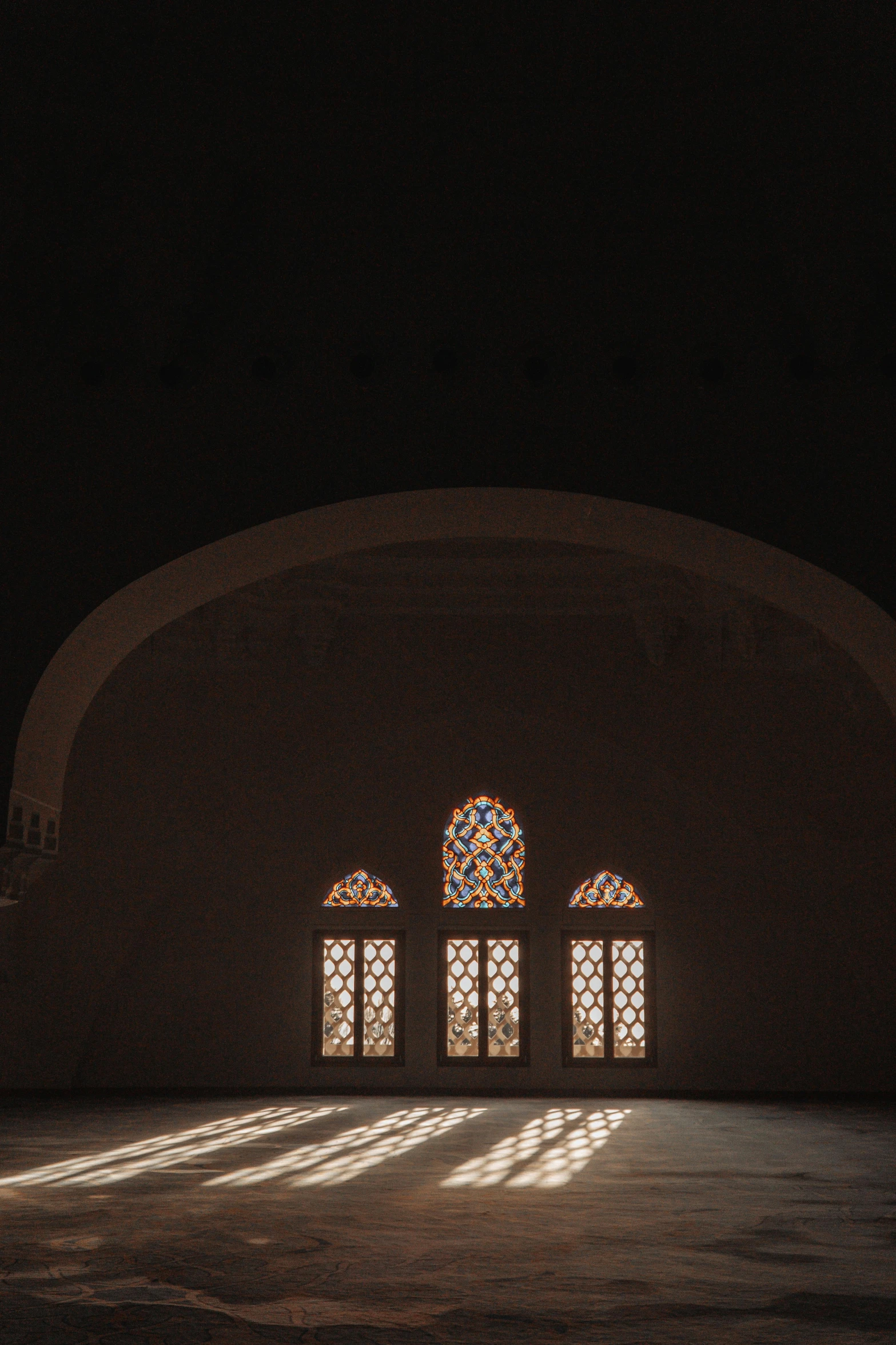 a view of an arch that shows three windows