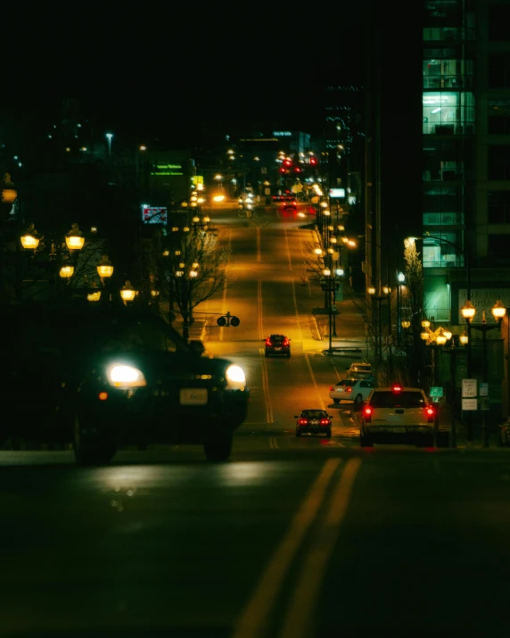 an image of cars driving at night time