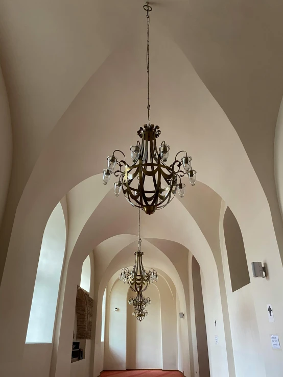 an empty room is seen with chandelier