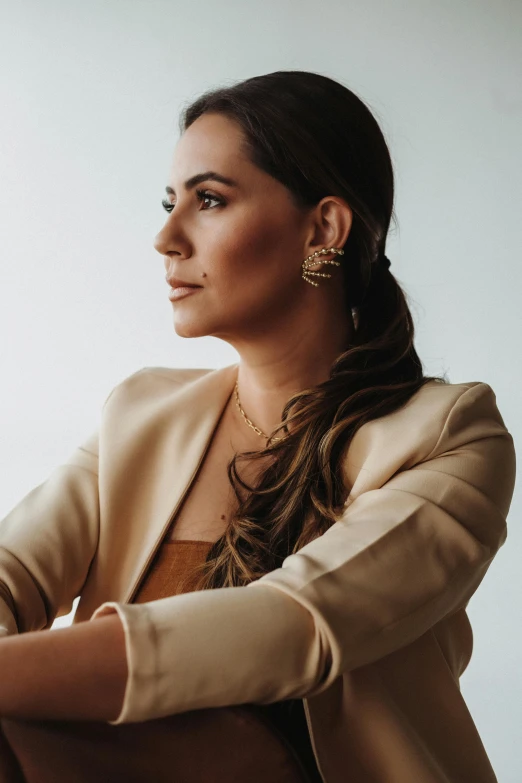 a woman is standing with her arms folded