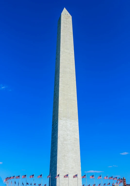 a tall obelisk in the middle of a clear sky