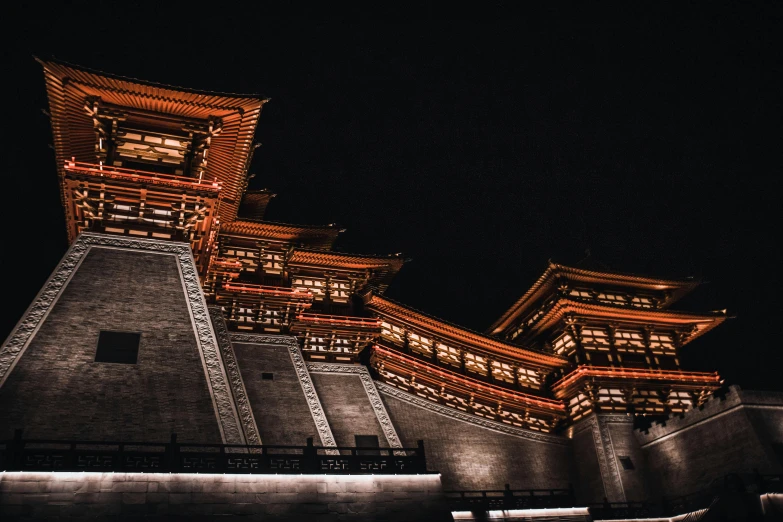 the architecture of the asian buildings are illuminated at night