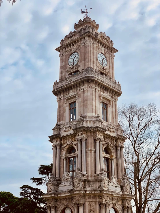 a very tall tower with some clocks on the sides