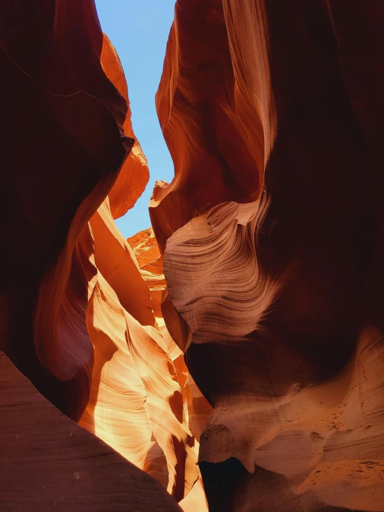 a narrow canyon between two rocky areas with sky above