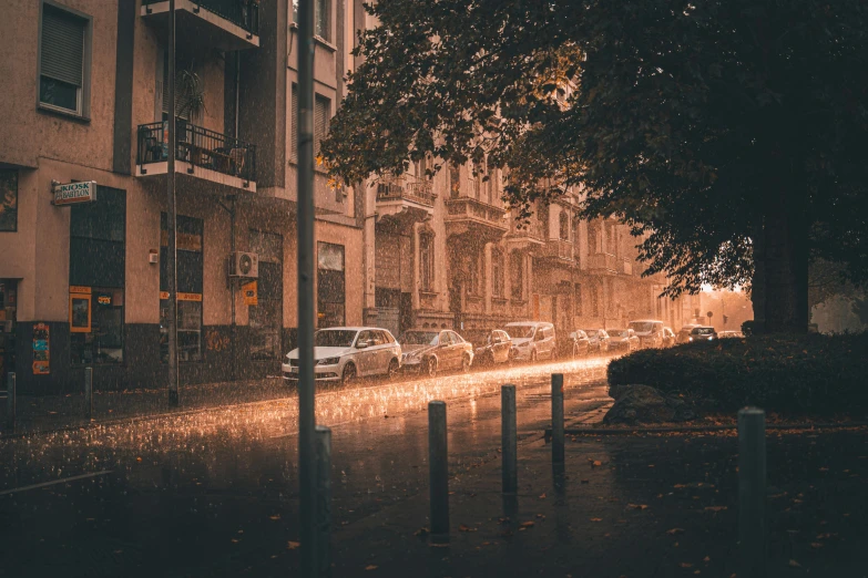 a car is parked on the side of the street in a rainy city