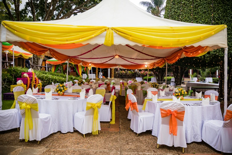 a tent for banquet style events and decorated for outdoor