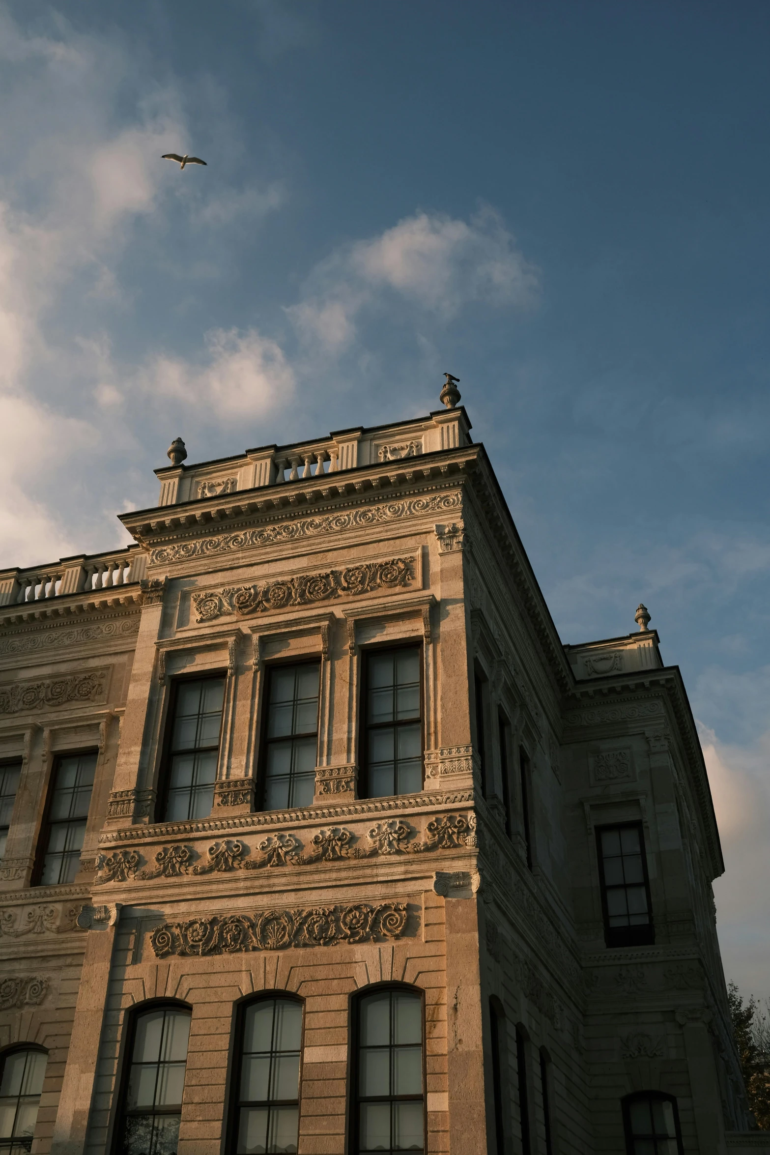 a large building with multiple windows under a blue sky