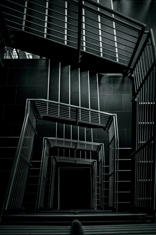 stairs with bars and rails and one way sign