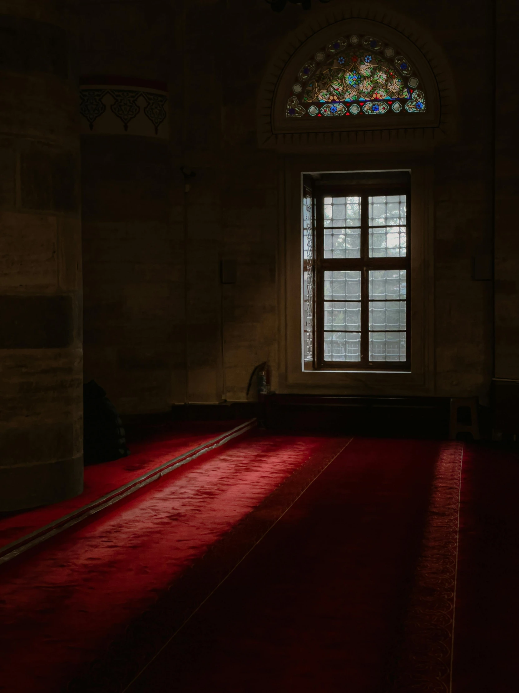 a floor in front of a very wide window