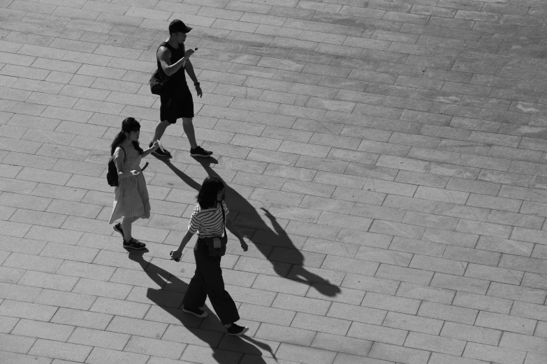 a group of people walking down a street