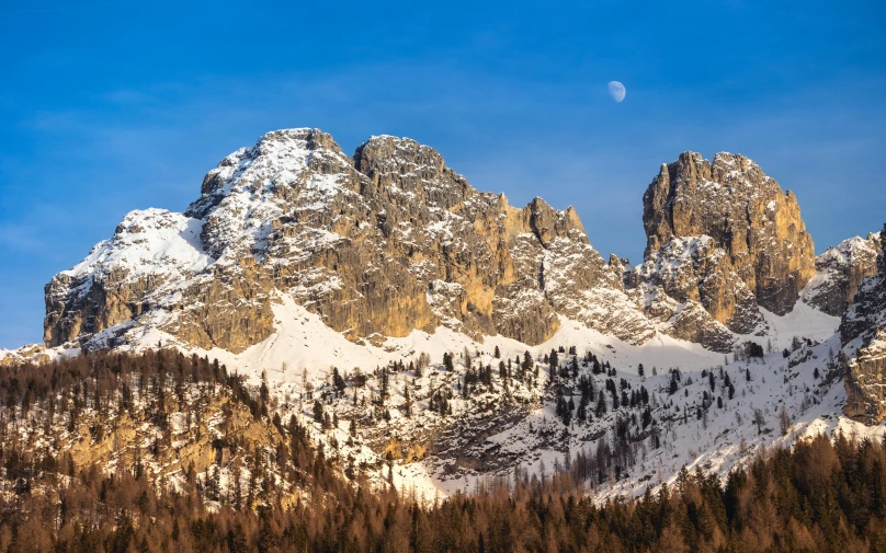 a large mountain with a snow covered top