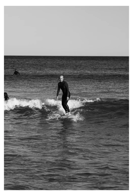 the surfer is out in the open water, waiting for a good wave