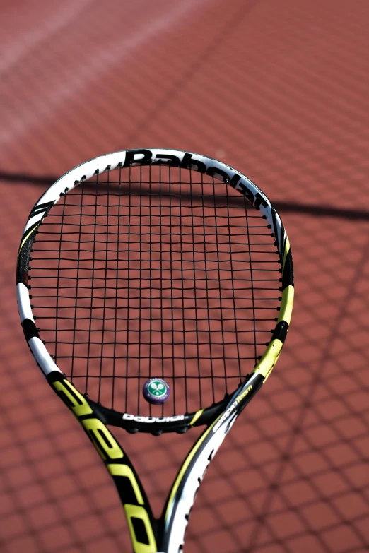 a close up of a tennis racket with the logo on it