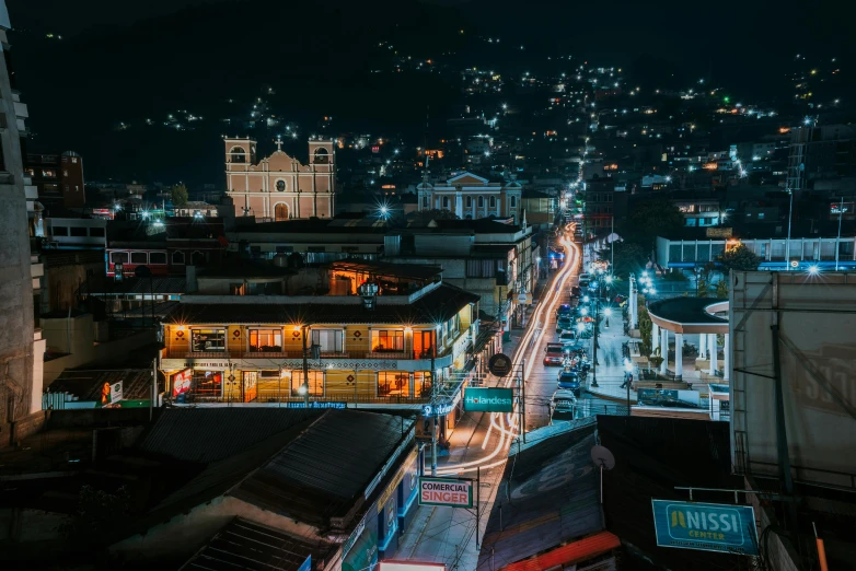 night time city view with mountains in the background