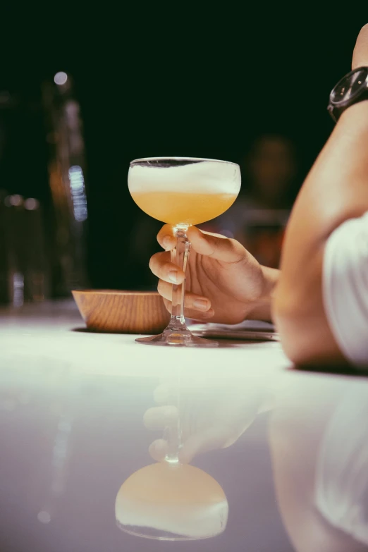 a glass is shown being filled with wine