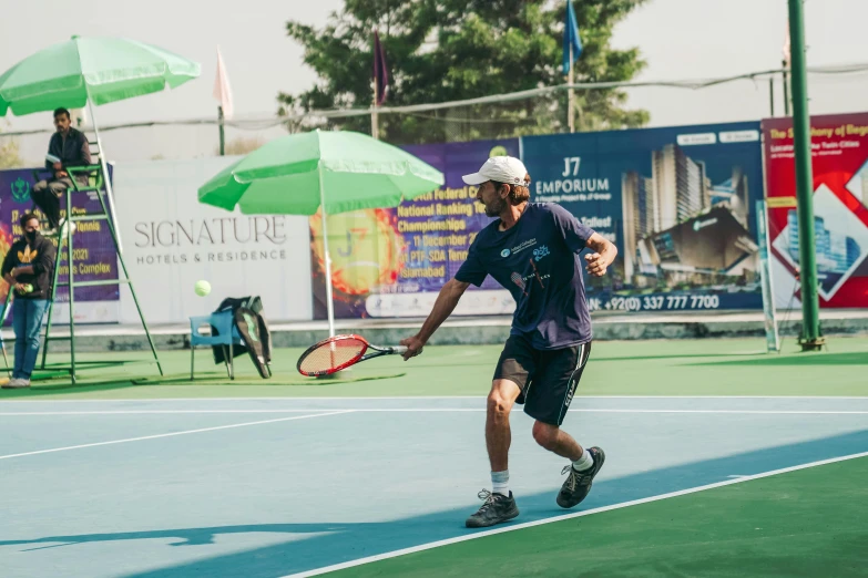 a person running while holding a tennis racket