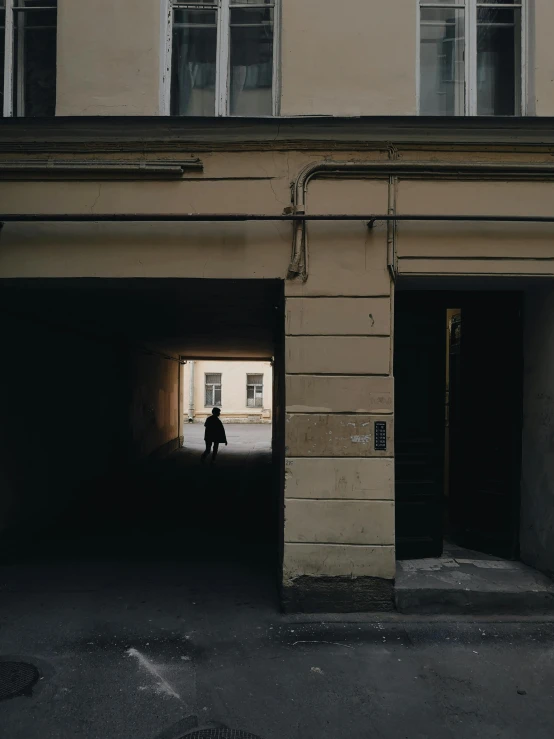 an image of a person standing in an alley