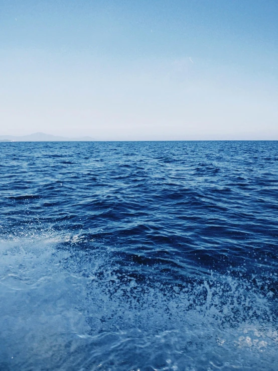 the water in front of a boat is very clear