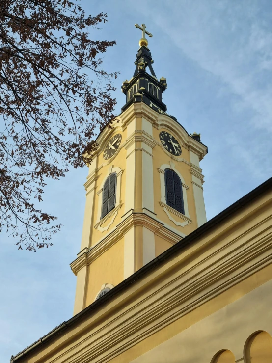 an ornate clock on the front side of a church