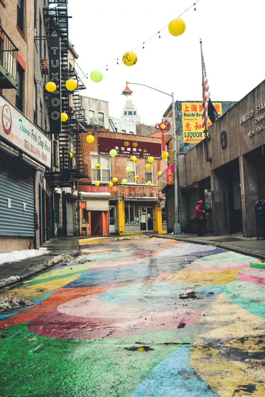 a brightly colored road and a building on the side