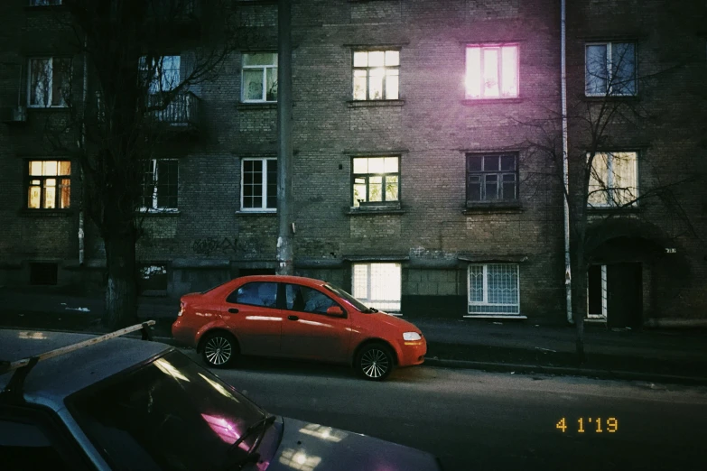 car parked on street at night in urban setting