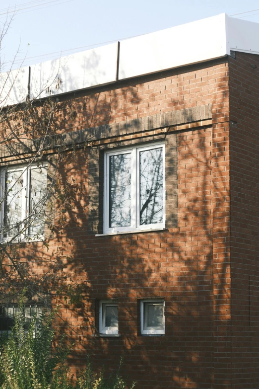 two window on the side of an apartment building