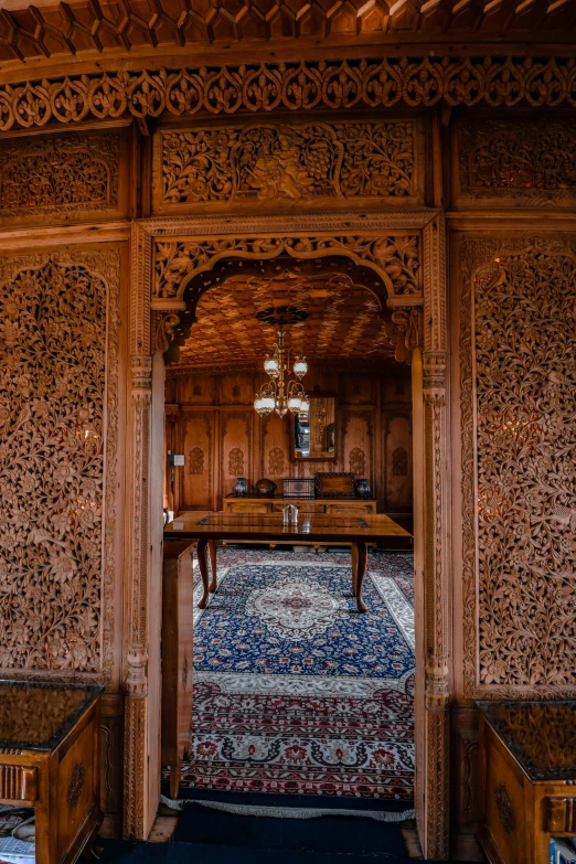 a large wooden room with a door leading to another room