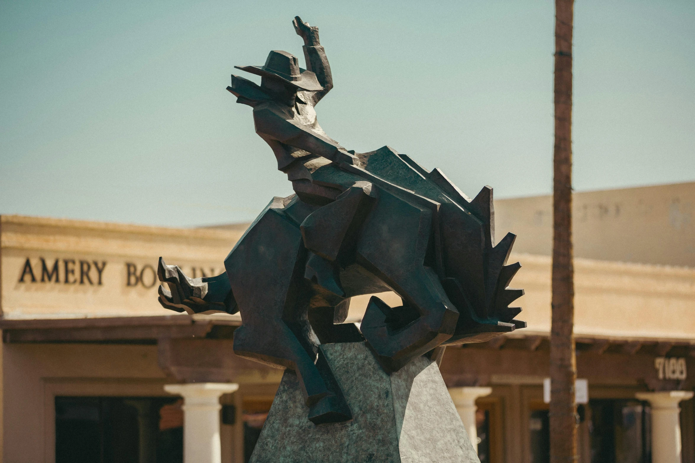 a statue sitting on top of a cement block