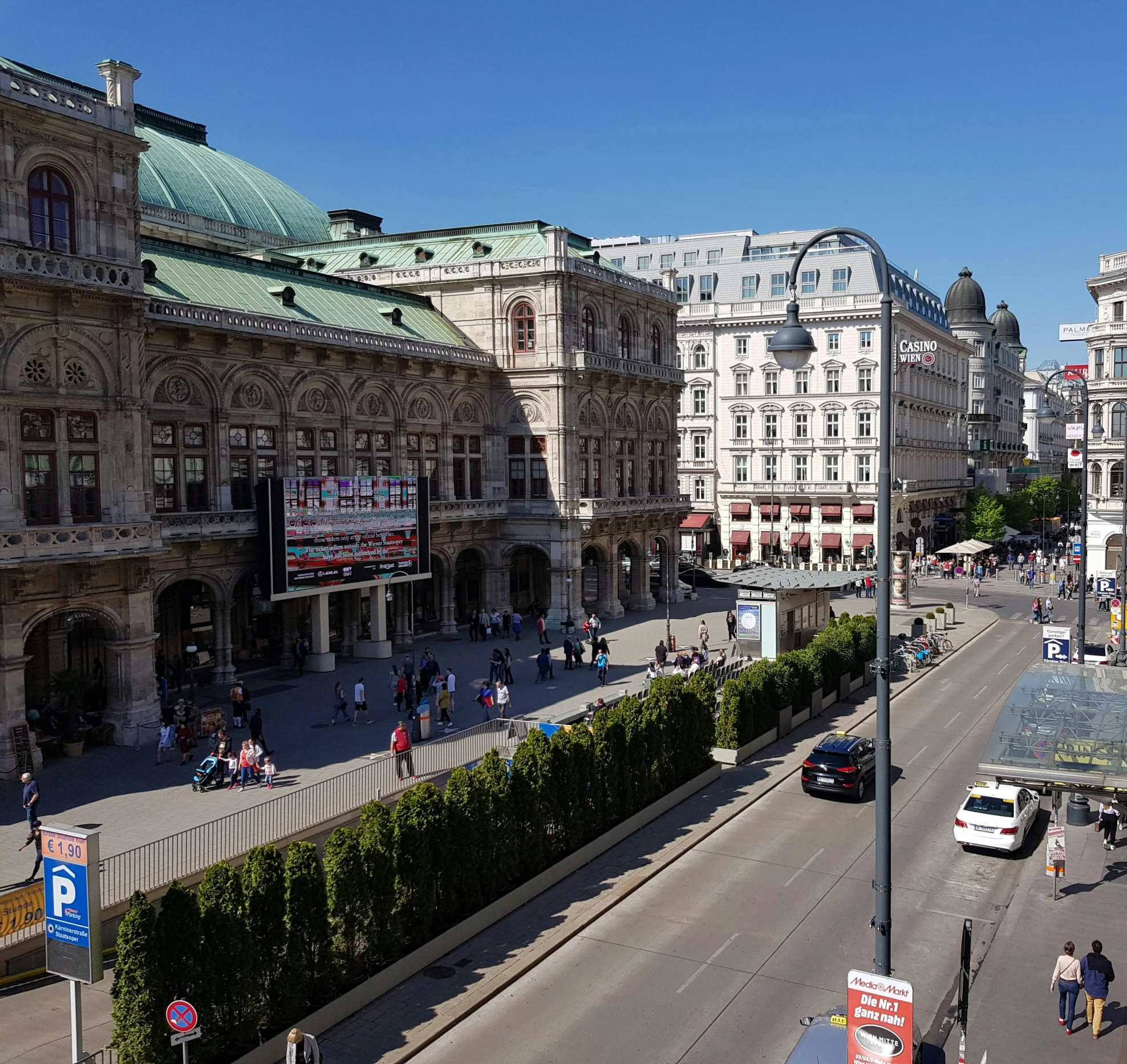 many people in city setting walking and eating