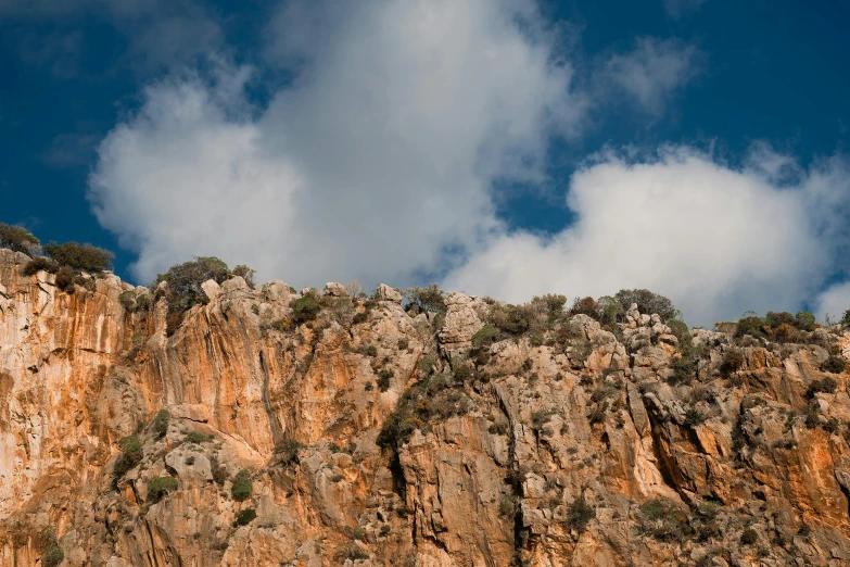 the mountains are steep and covered with rock formations