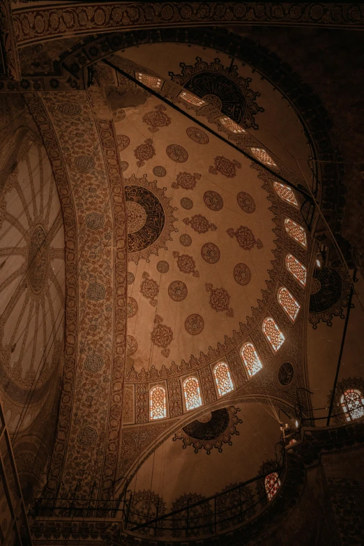 inside the dome of a large building with intricate designs