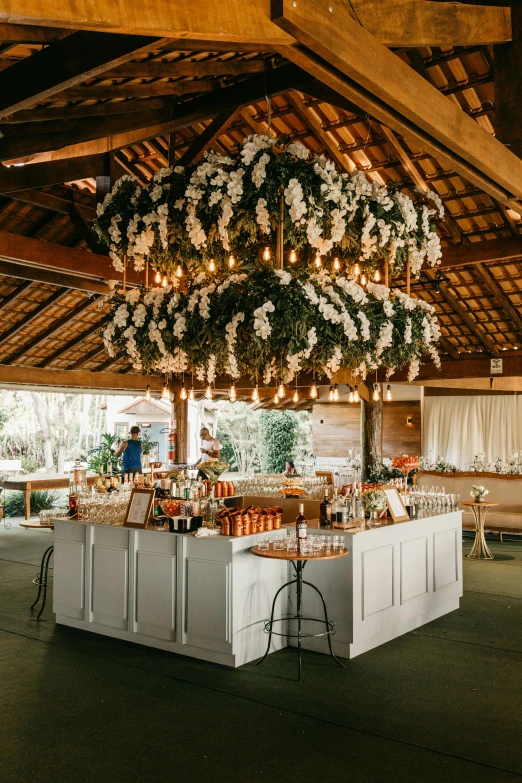 a bar is decorated with flowers for a wedding reception