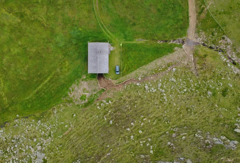 an aerial po of an old house and yard