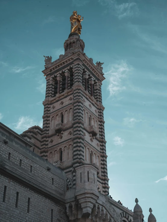 a large tall building with a very large clock on the top